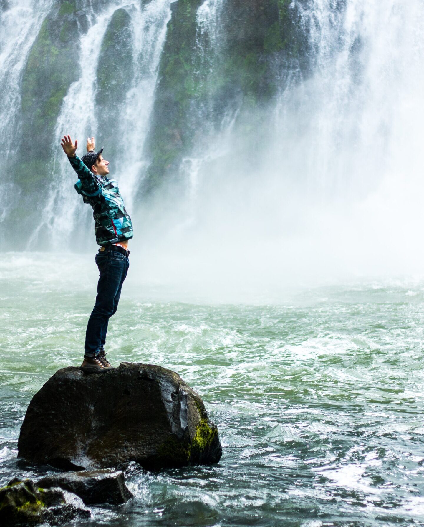 Person standing at the edge of a cliff, embracing fear and taking risks to thrive after failure. Person standing at the edge of a cliff, embracing fear and taking risks to thrive after failure.
